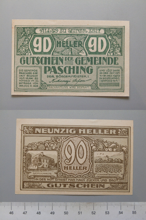 Alte deutsche Banknote mit Lineal daneben, mit gedrucktem Text und Zahlen, mit einer Skala unten.
